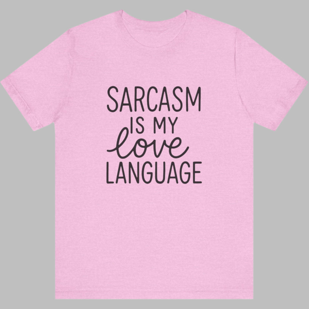 Pink t-shirt with 'Sarcasm is my love language' text on a white background