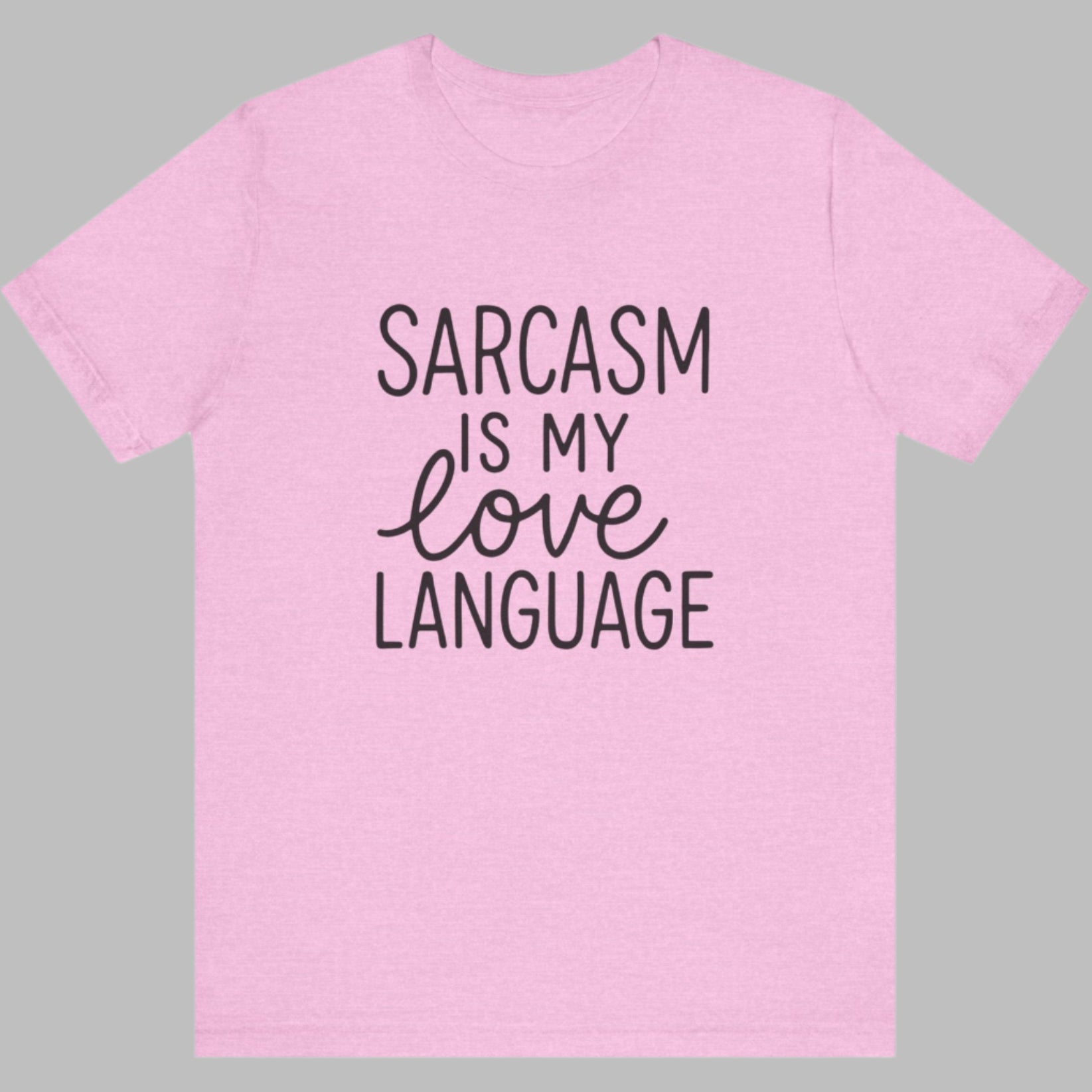 Pink t-shirt with 'Sarcasm is my love language' text on a white background