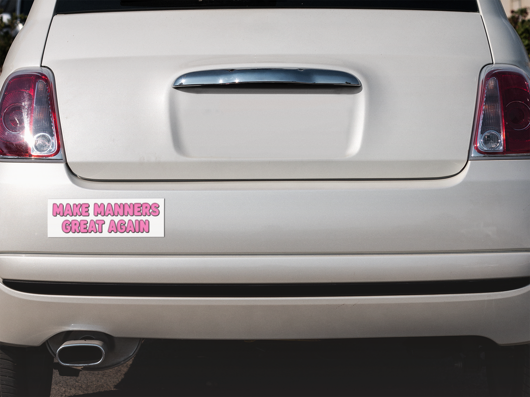 Car trunk with a humorous bumper sticker reading 'Make Manners Great Again'.