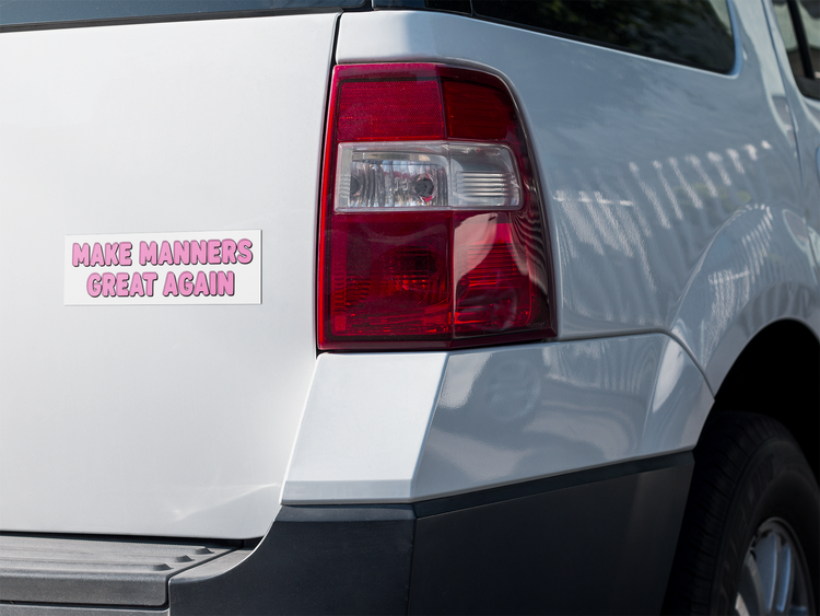 Car with a bumper sticker on the back, featuring text.