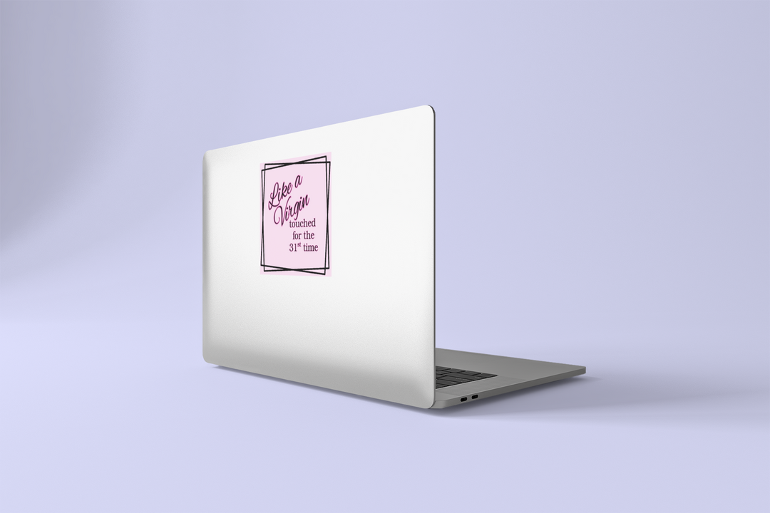 Laptop with a pink Like a Virgin sticker on a light purple background
