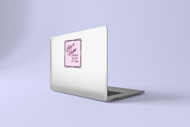 Laptop with a pink Like a Virgin sticker on a light purple background