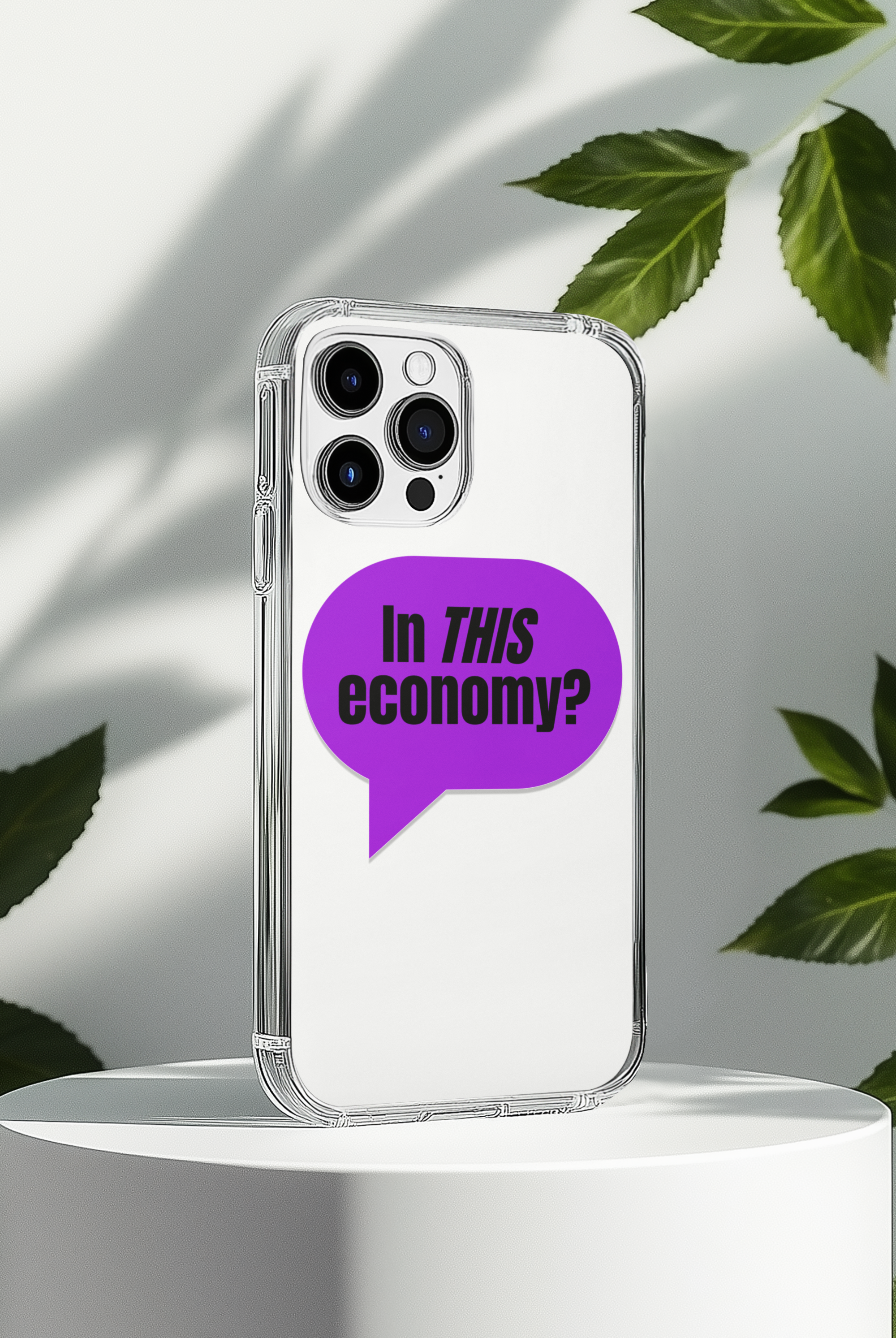 Phone case with a purple speech bubble and text 'In THIS economy?' on a white background with green leaves.