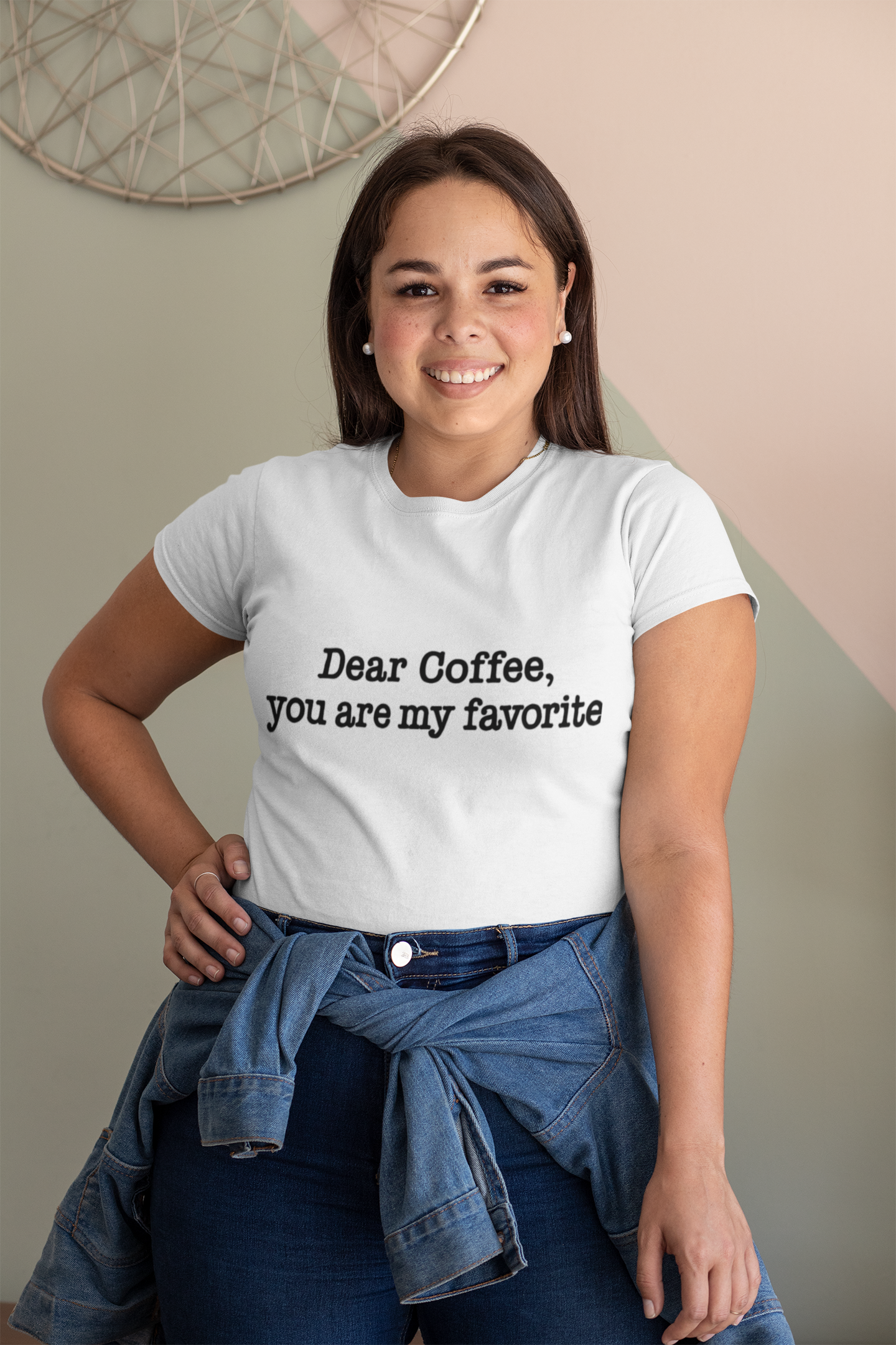 Woman wearing a white t-shirt with 'Dear Coffee, you are my favorite' text.