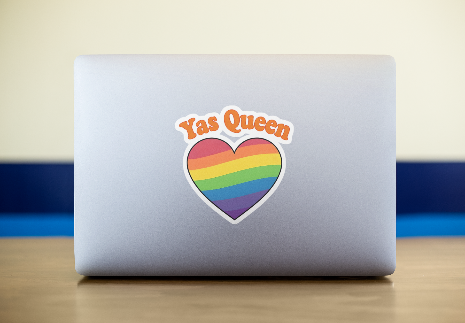 “YAS Queen rainbow sticker on laptop, perfect for showing sass and style at work or school”