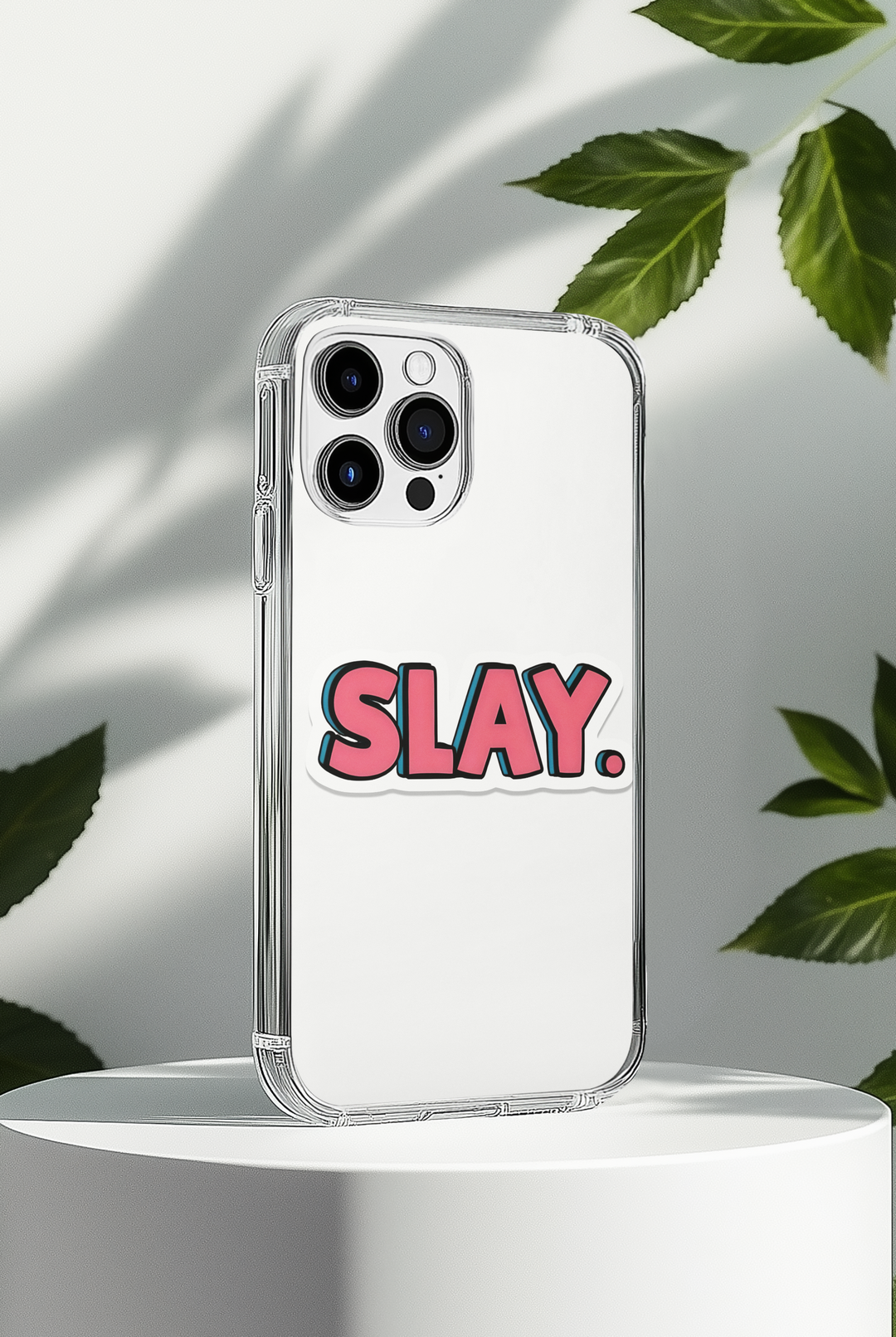 Phone case with 'SLAY.' text on a white background with leaves