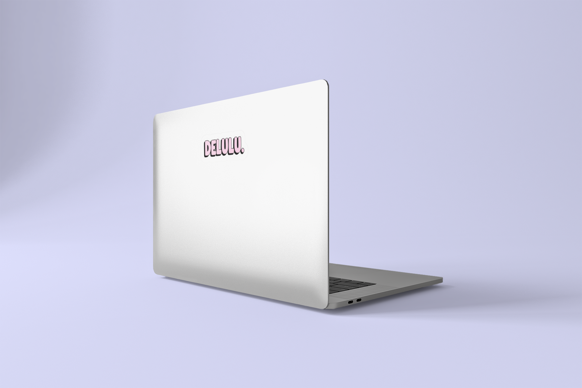 Silver laptop with a DELULU on a light purple background.